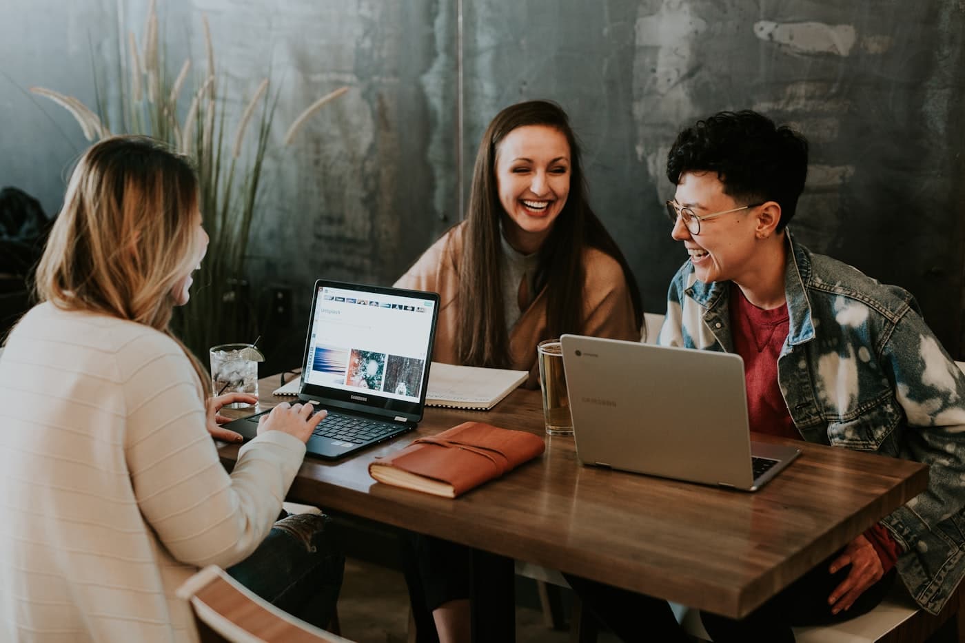 Early users comparing notes over laptops